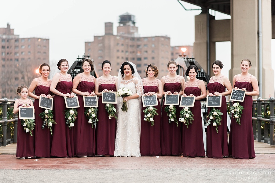 pearl street wedding photo of bridesmaids with signs