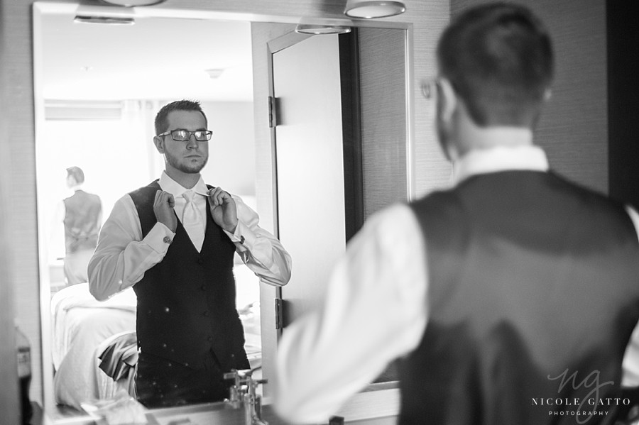 Groom getting dressed at sheraton at the falls