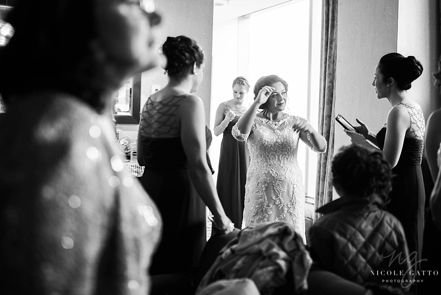 Wedding at The Embassy Suites bride surrounded by bridesmaids