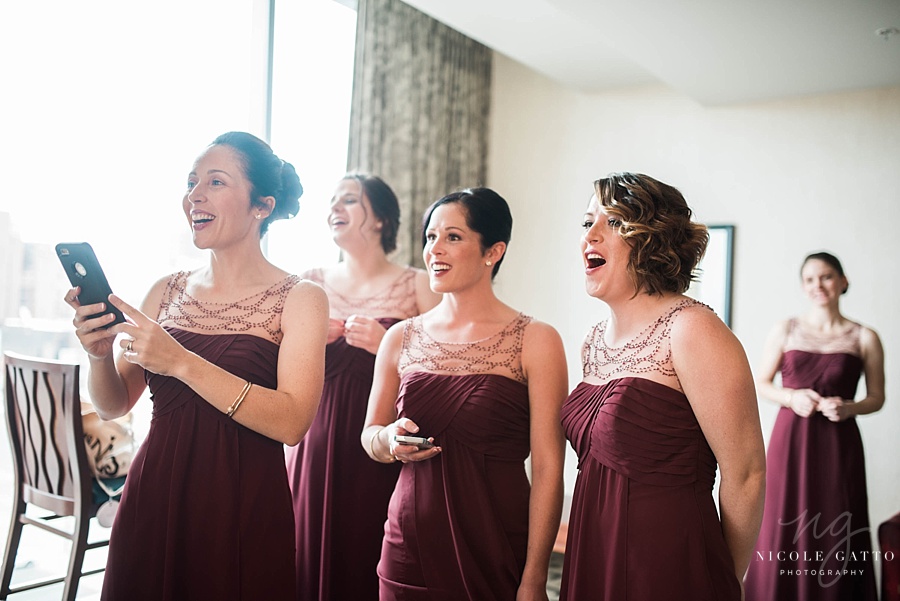 Wedding at The Embassy Suites bridesmaids seeing bride for the first time