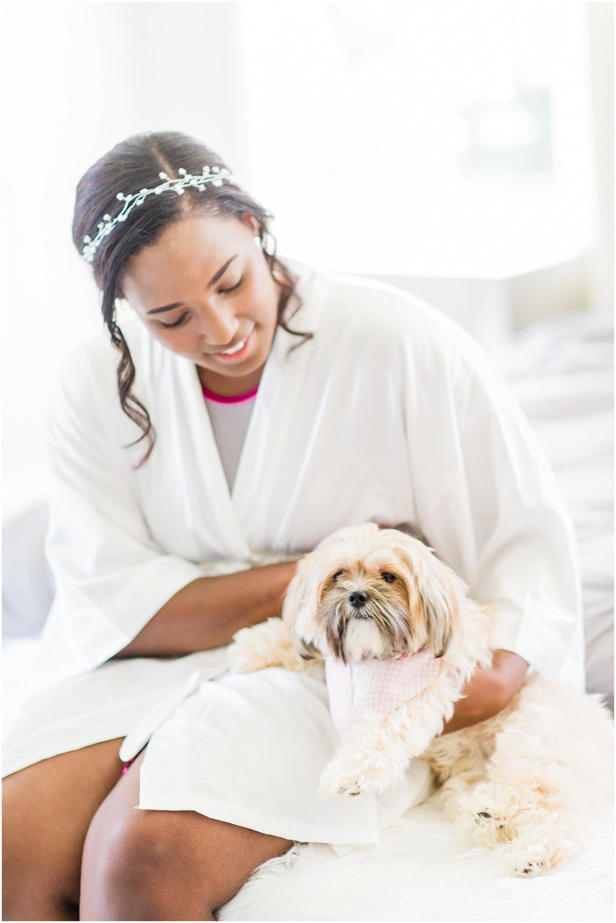 Bride in robe with her puppy