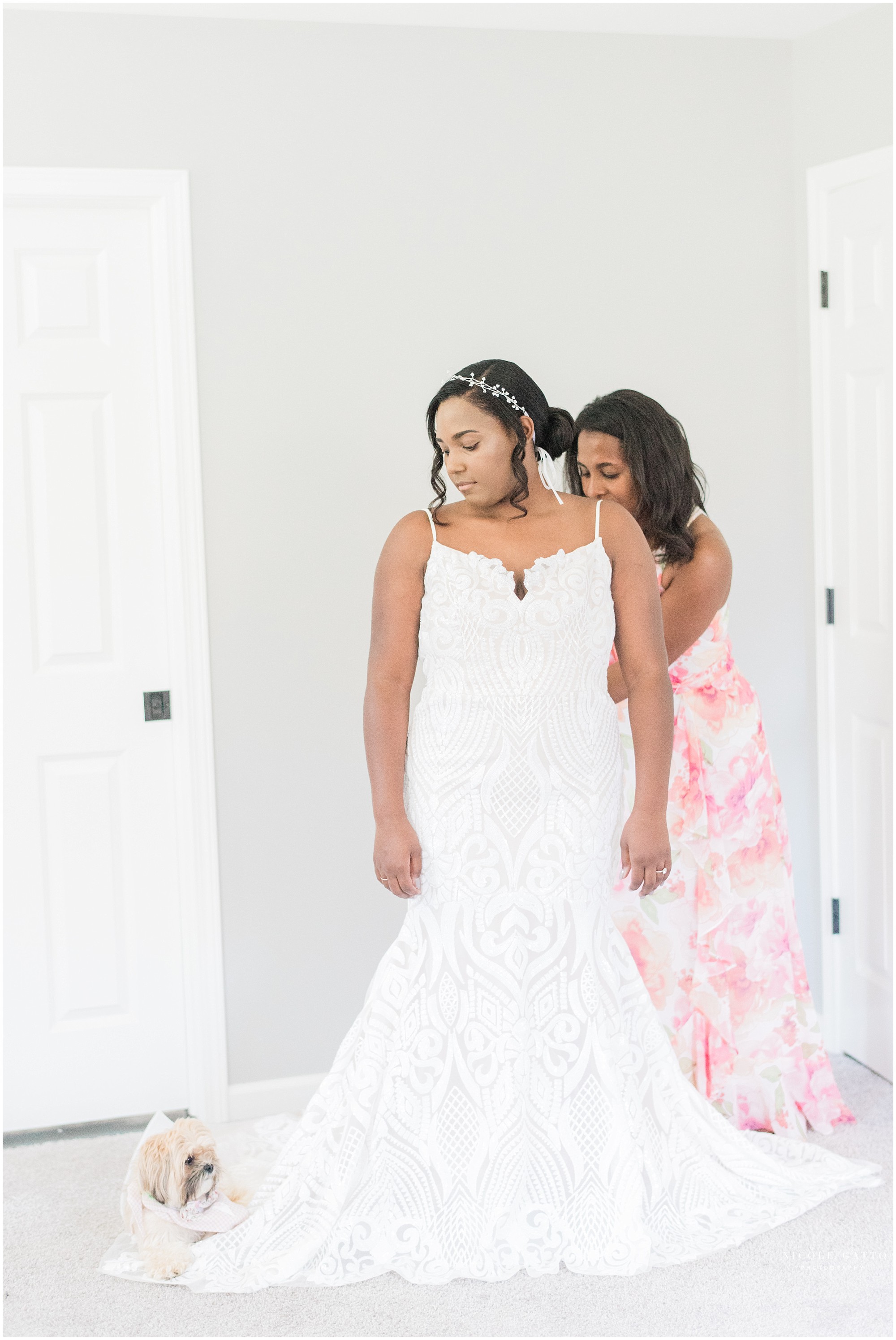 bride putting on Miss Hayley Paige Dress