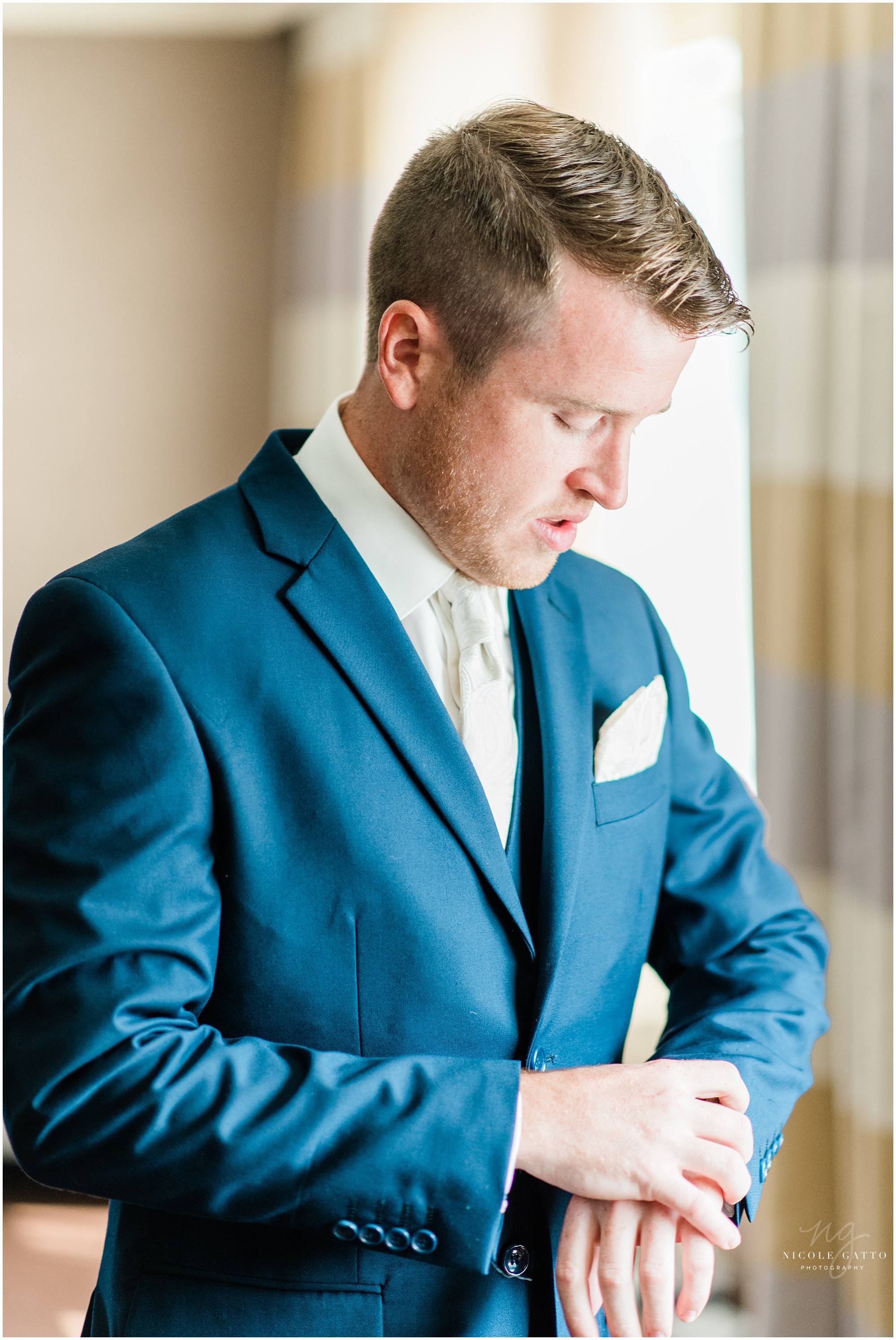 groom getting dressed at the sheraton at the falls on third st niagara falls ny