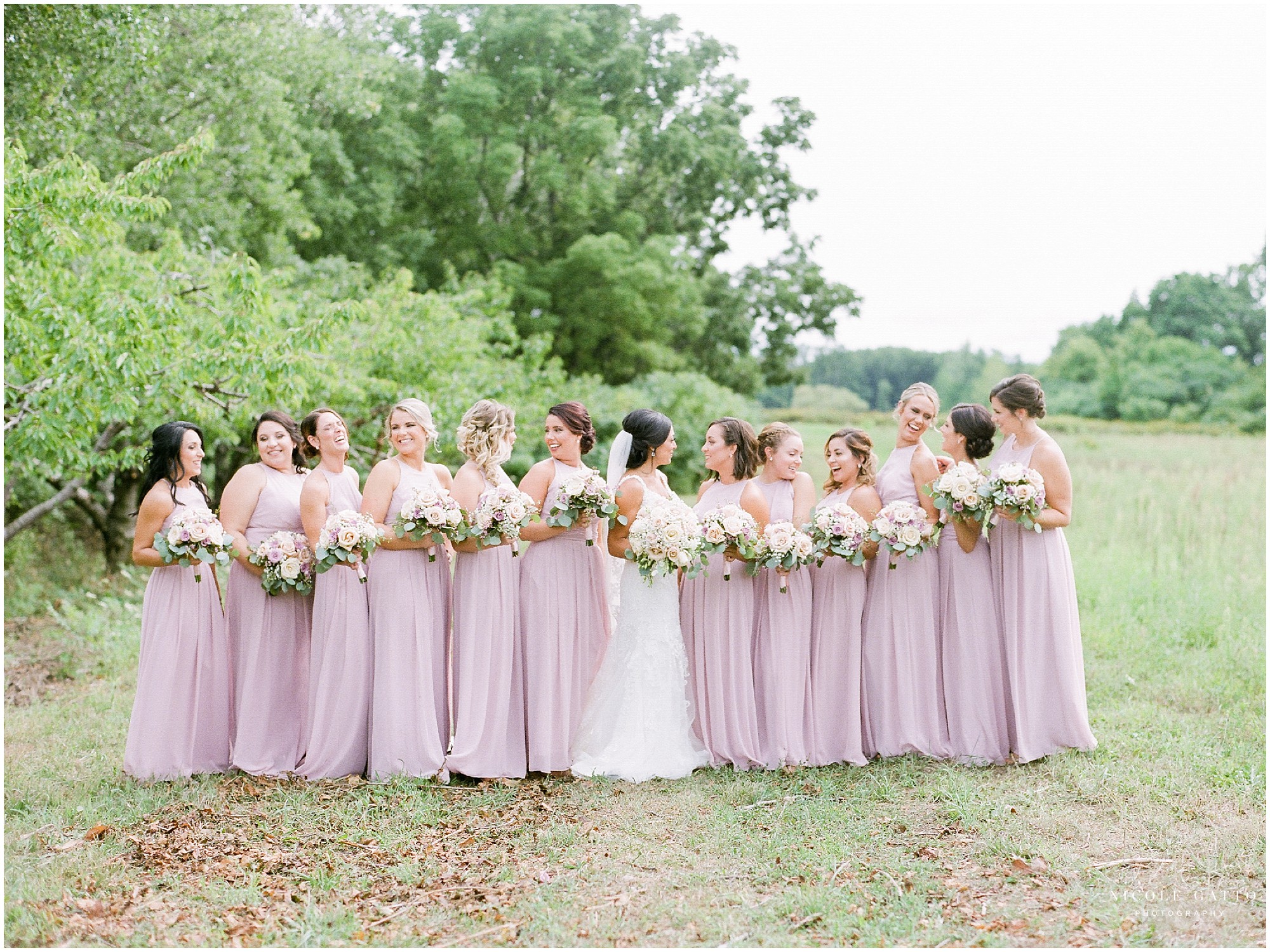 Blush bridesmaids dresses with rustic location