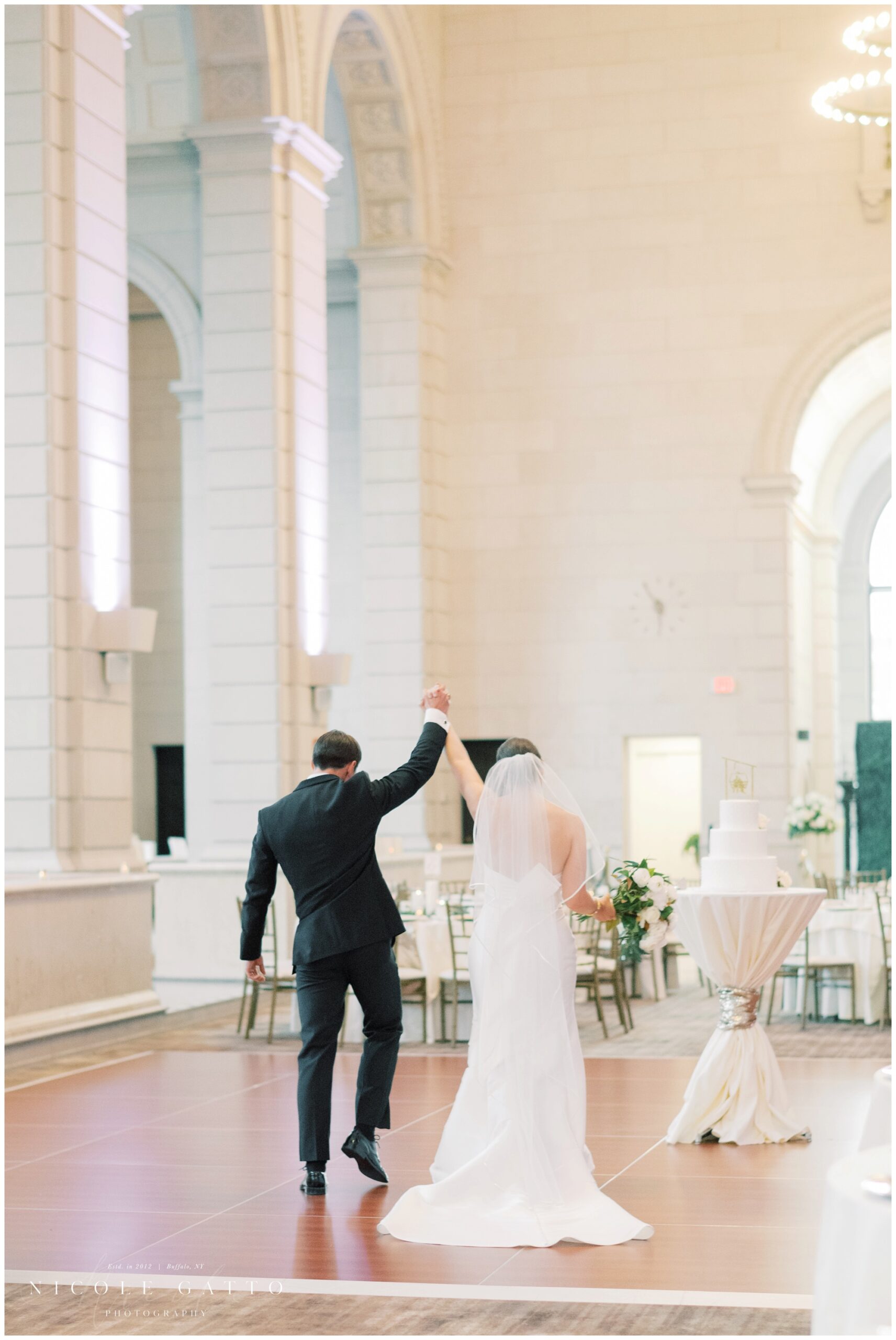 bride and groom walking up the aisle after ceremony at the admiral room in bufalo ny