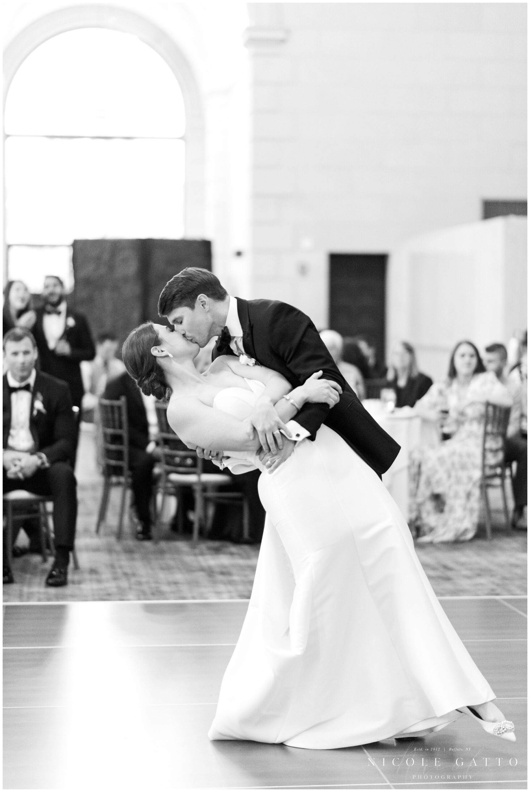 groom dipping bride during first dance at the admiral room 