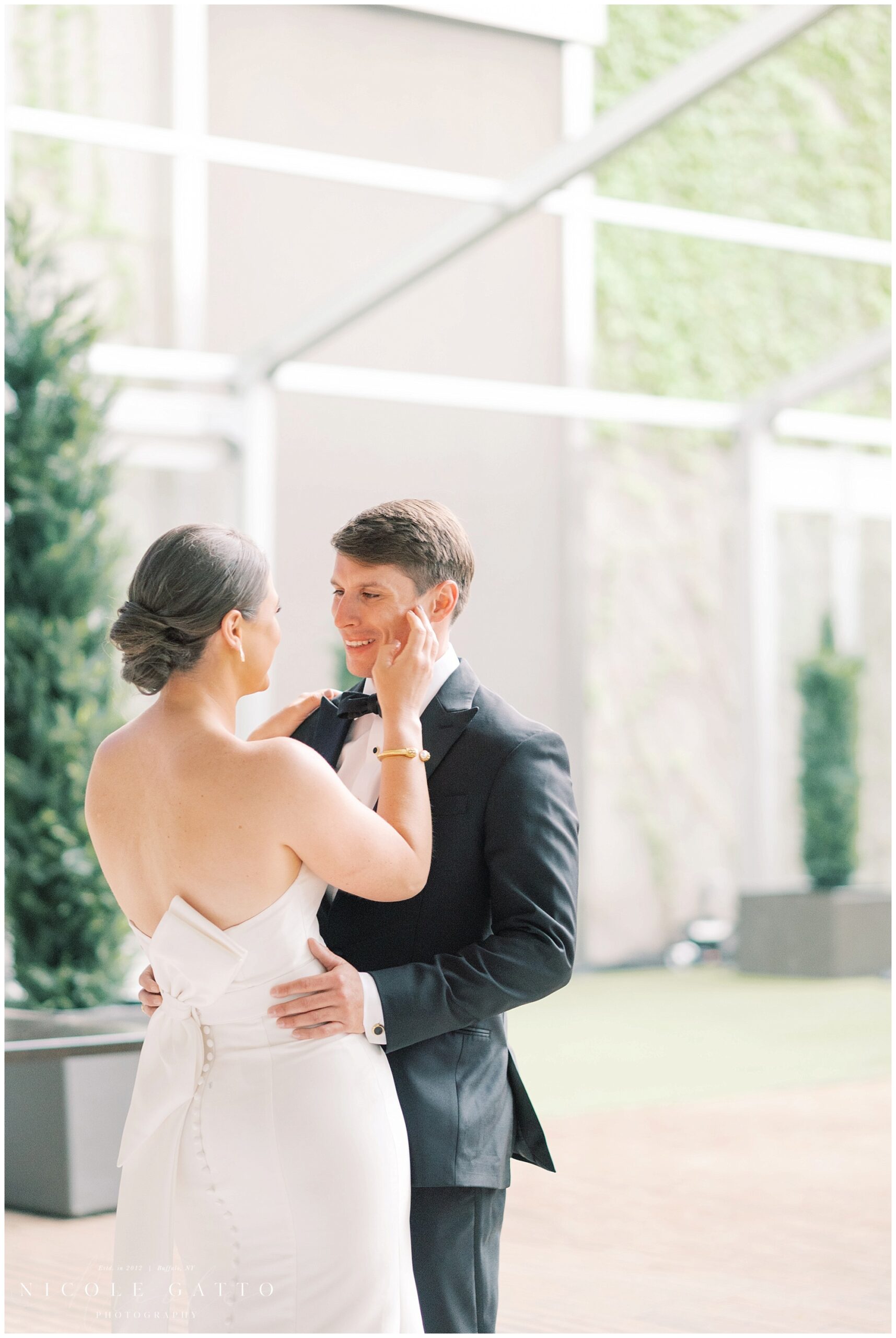 bride touching grooms face in buffalo ny