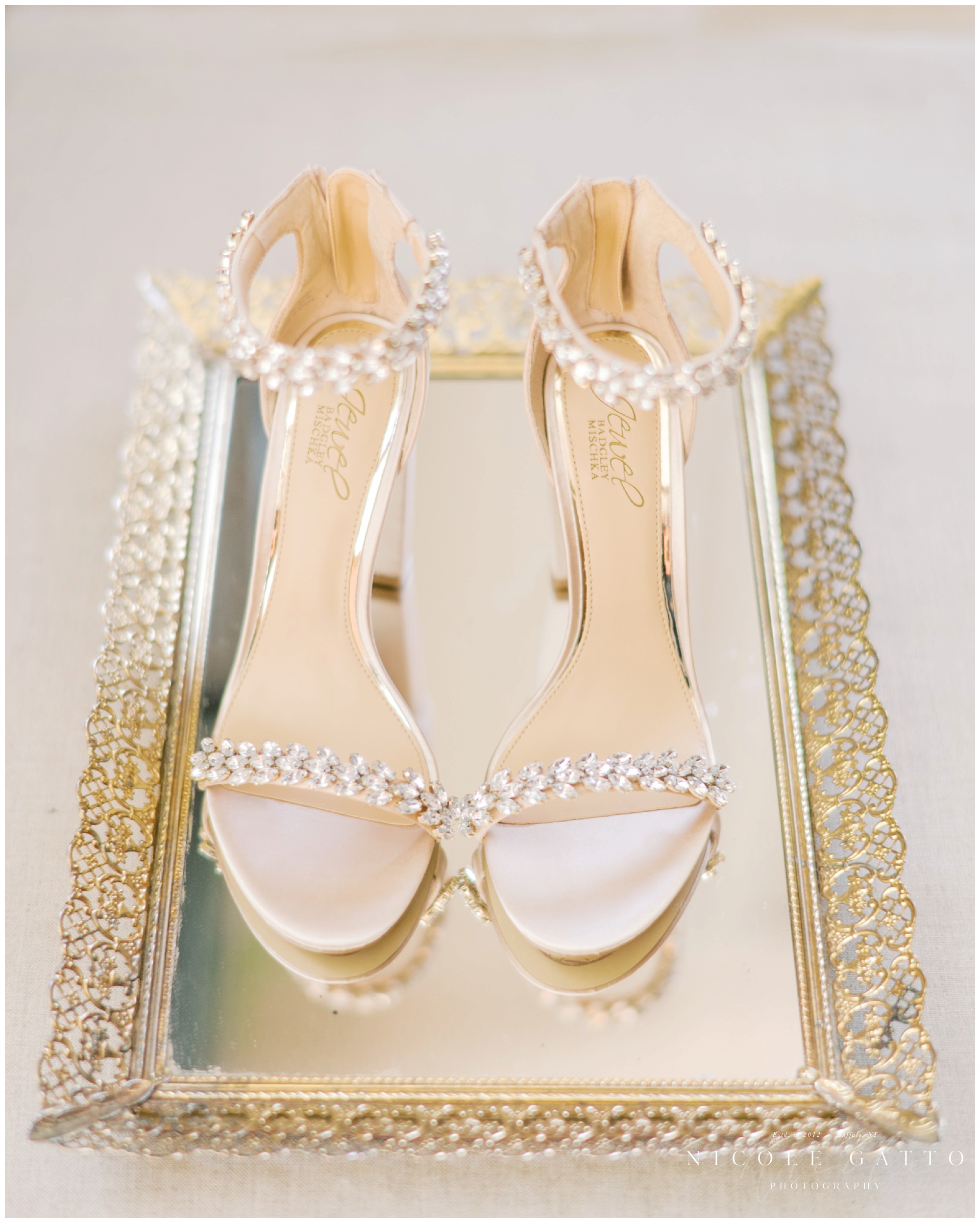 brides shoes on glass mirror