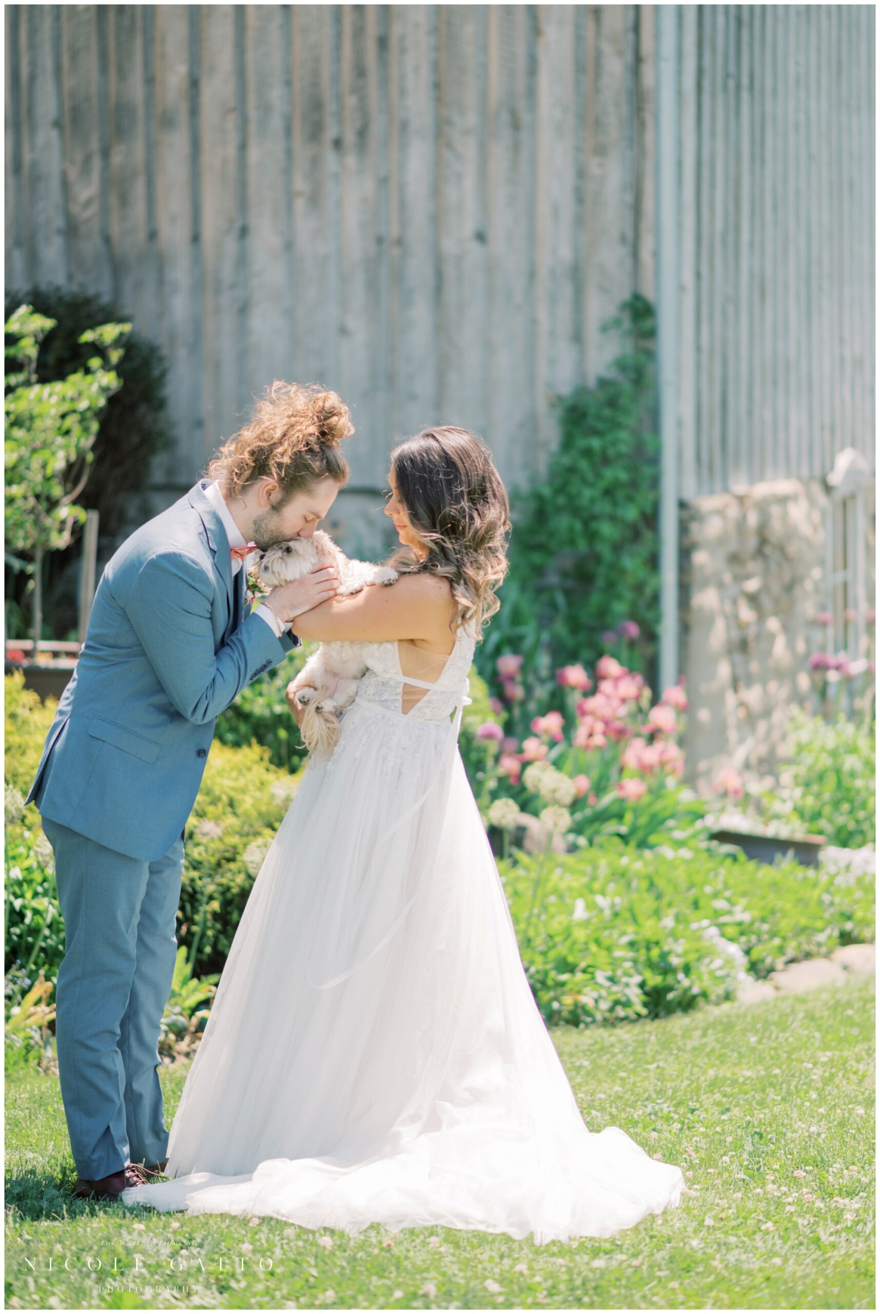 bride and groom with their dog for their wedding at hayloft in the grove