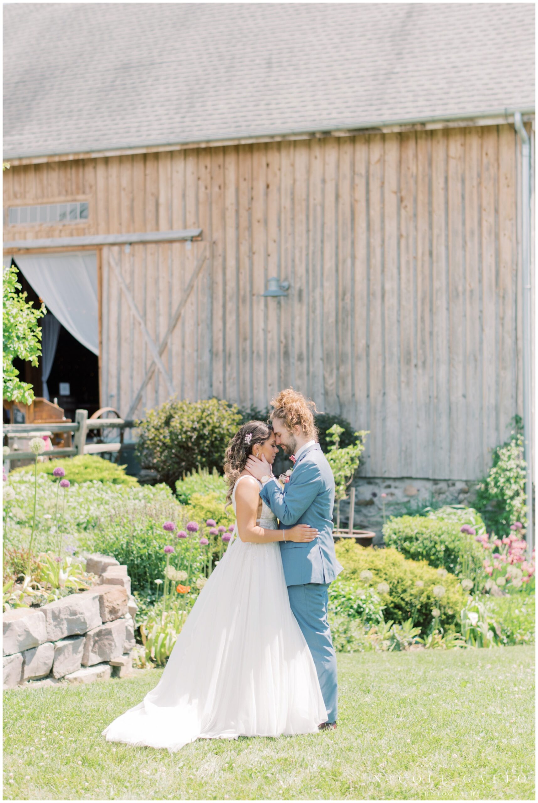 bride adn groom at their wedding at hayloft int he grove 