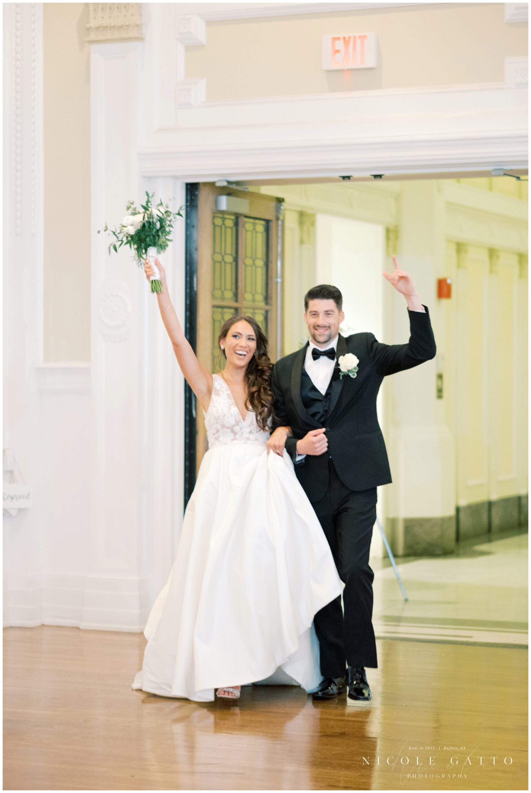 bride and groom walking into marquis ballroom for their Wedding_at_Hotel_Lafayette-