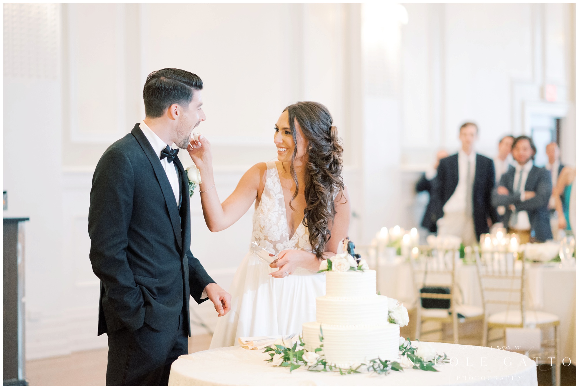 bride feeding groom cake wedding at hotel Lafayette 